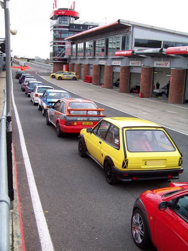 Retro Fords lined up at Brands Hatch