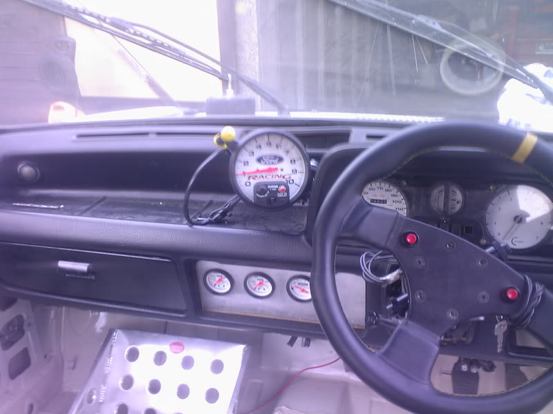 Racing steering wheel fitted to a retro ford fiesta